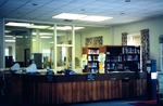 The Circulation Desk at Cushing-Martin Library by Jennifer M. Macaulay